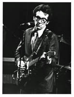 thumbnail link to original c.1977 Andre Csillag photograph of Elvis Costello